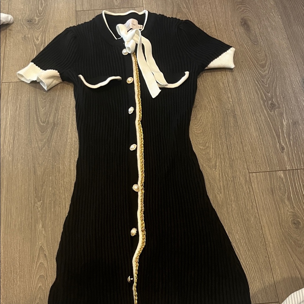 Chic Black and White Midi Dress with Gold Accents